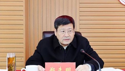 郑先明，主动投案